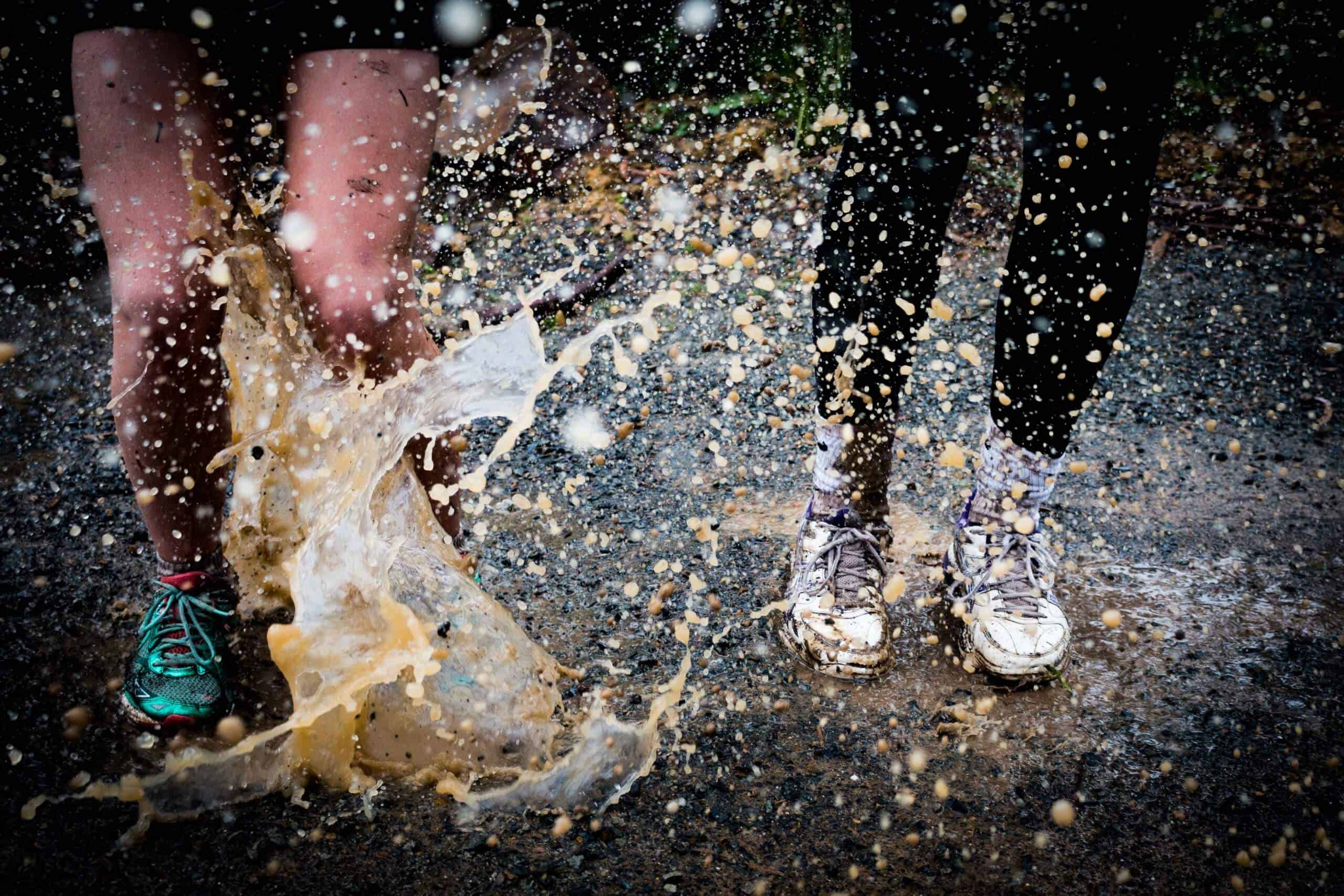 two women running splashing water