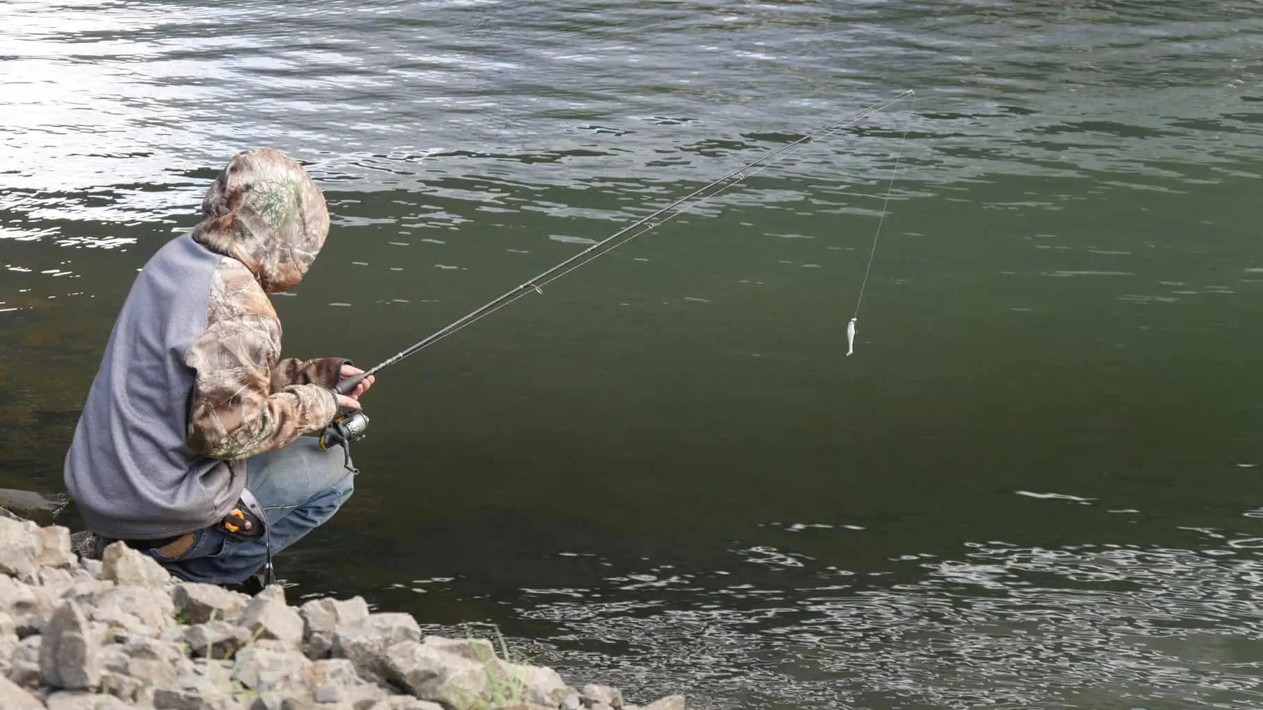 Man fishing with one of the best inshore spinning rods under 100