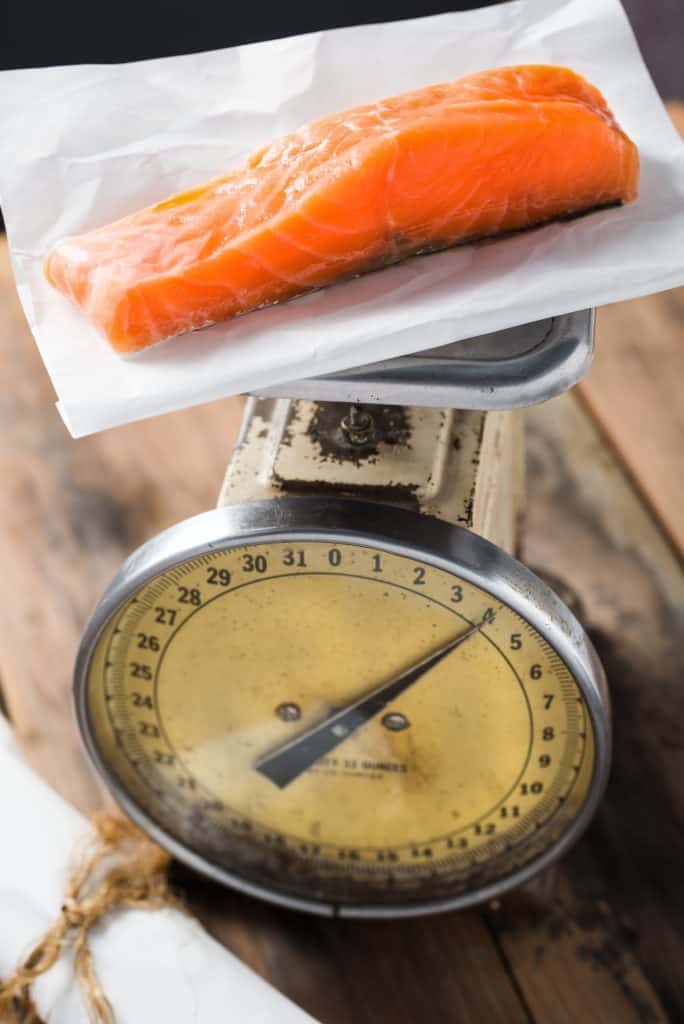 Fresh Organic Salmon Fish on a food scale