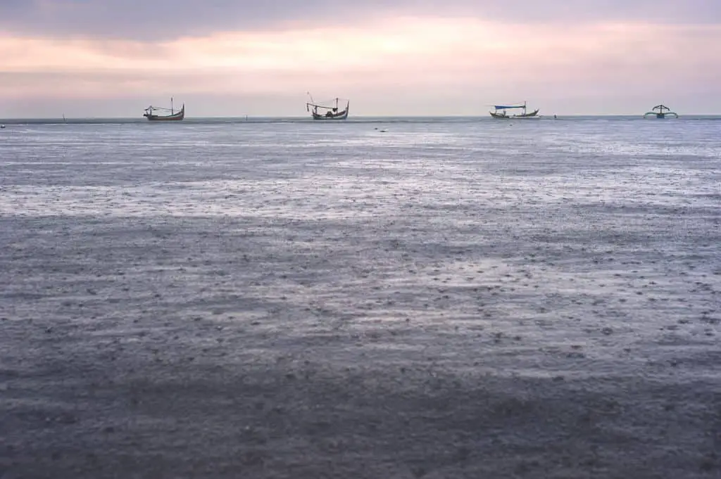 Traditional Indonesian fishing boats in the rain