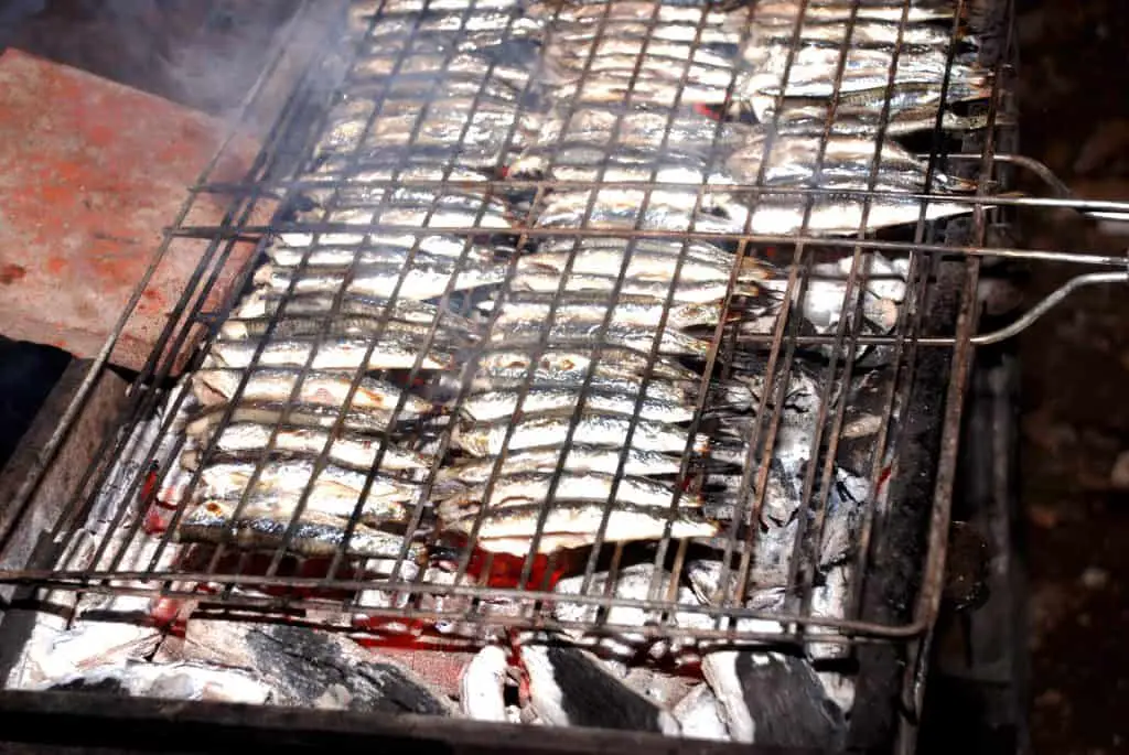 Anchovies on one of the best fish grilling baskets on charcoal