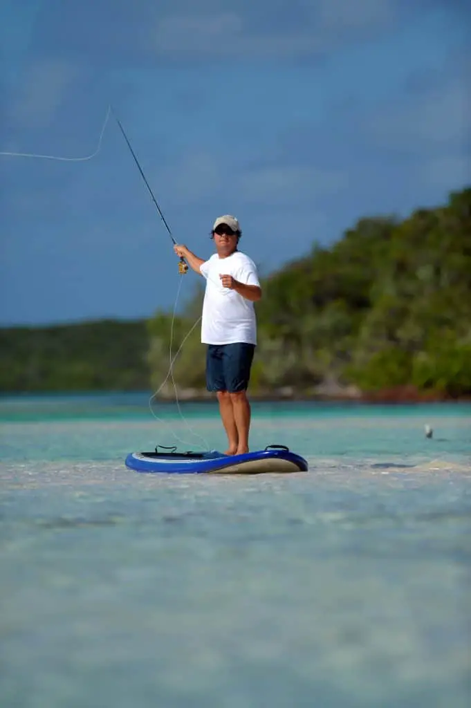 Casting a Fly fishing rod in the Bahamas on a paddleboard