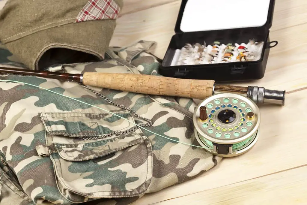 Fly Fishing Gear lying on a wooden table