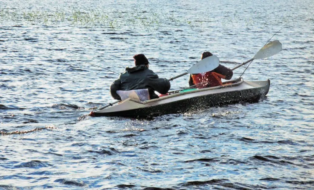 Swimming on a canoe on northern lake