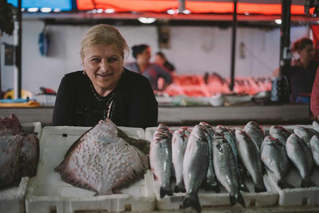 woman selling flounder and other fish