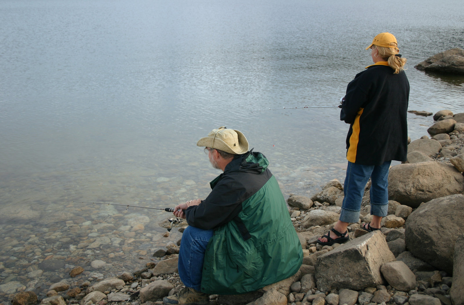 After obtaining their Colorado Fishing License, a couple goes fishing